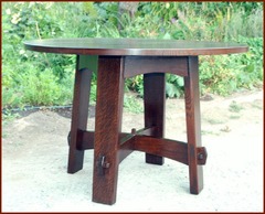 Replica Gustav Stickley splay leg table.